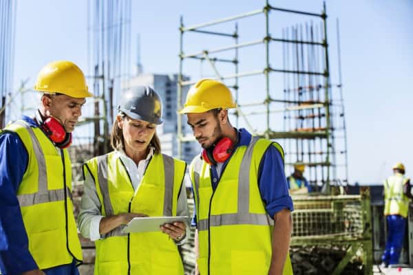 Architects Using Digital Tablet At Site